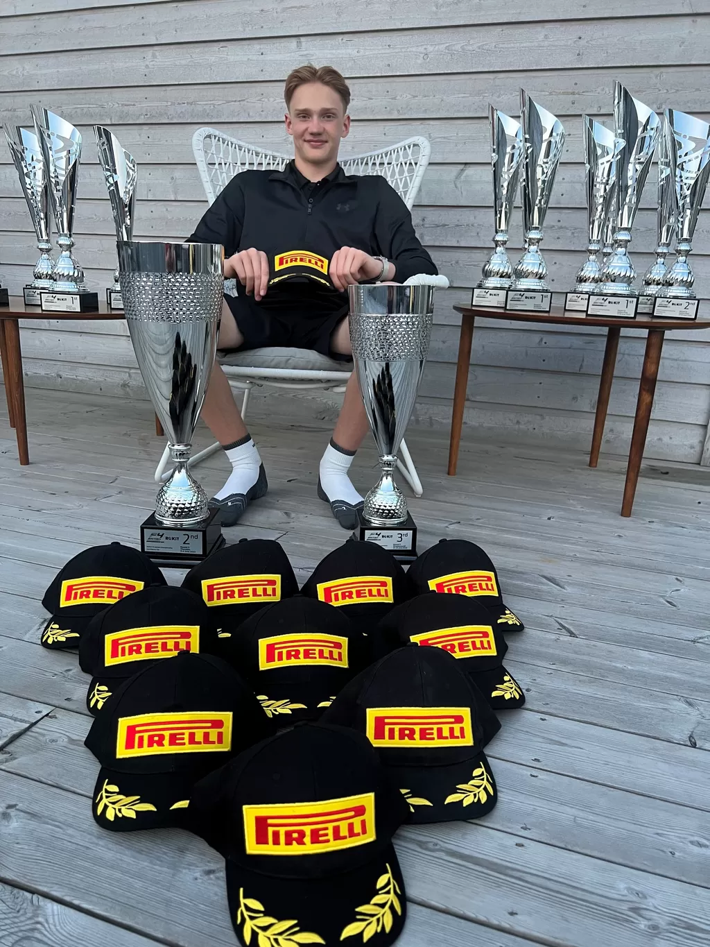 Gustav Johnson with some of the trophies he won while competing in Formula 4.
